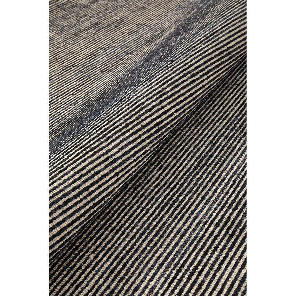 Allie Black Cotton Rayon Rug featuring striped pattern in black and beige on cream background, handwoven cotton-rayon blend