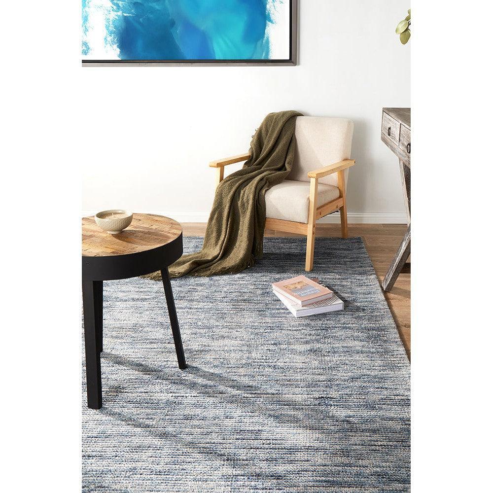 Allie Indigo Cotton Rayon Rug featuring textured gradient pattern in indigo, navy, blue-gray on ivory background, hand-tufted cotton-rayon blend