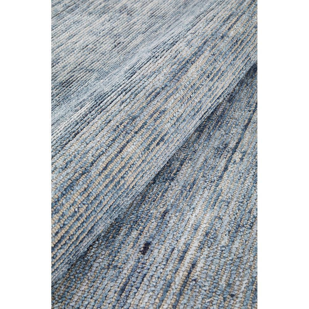 Allie Indigo Cotton Rayon Rug featuring striped abstract pattern in indigo, navy, sky blue and cream on light beige, power-loomed cotton-rayon
