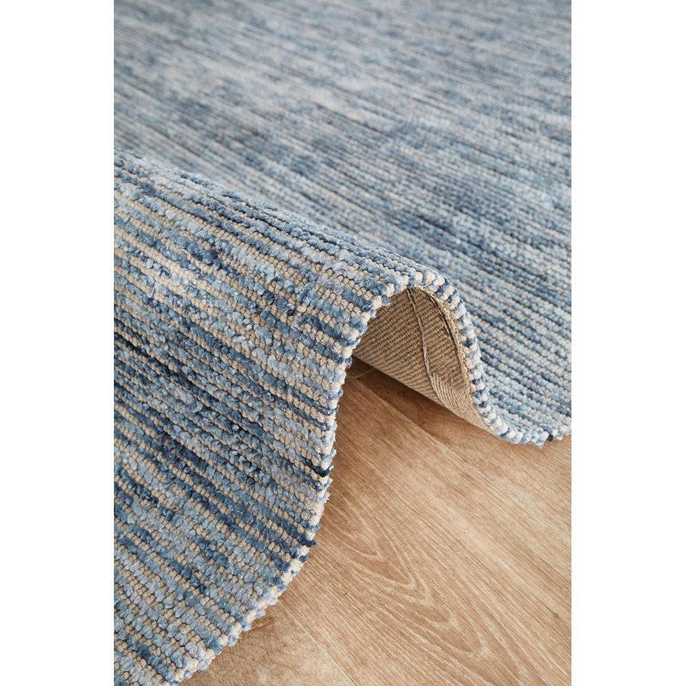 Allie Indigo Cotton Rayon Rug featuring striped looped pile in navy, indigo and steel blue on beige backing, hand-tufted cotton–rayon blend