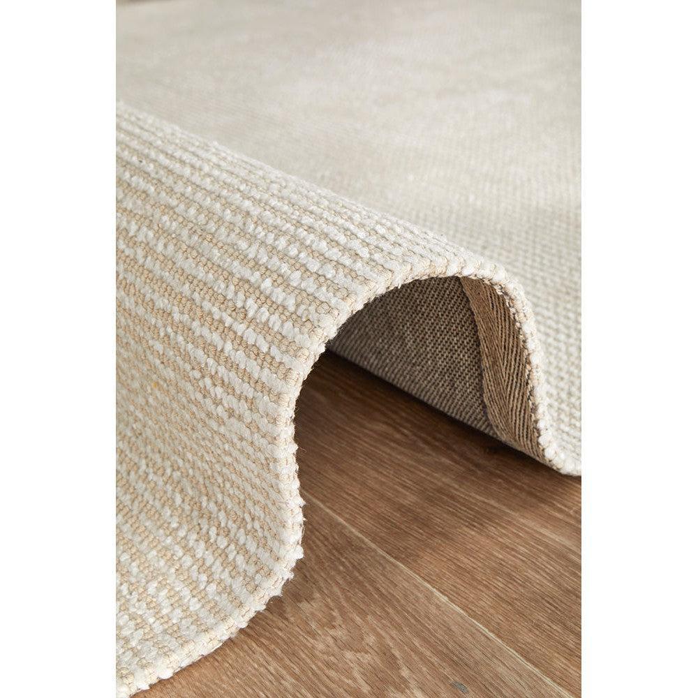 Allie Ivory Cotton Rayon Rug featuring solid ivory textured loop weave on cream background, machine-made cotton‑rayon