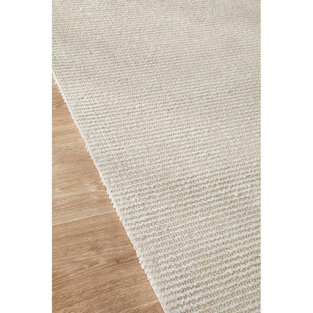 Allie Ivory Cotton Rayon Rug featuring solid colour design in ivory and cream on light brown wooden floor, woven cotton-rayon