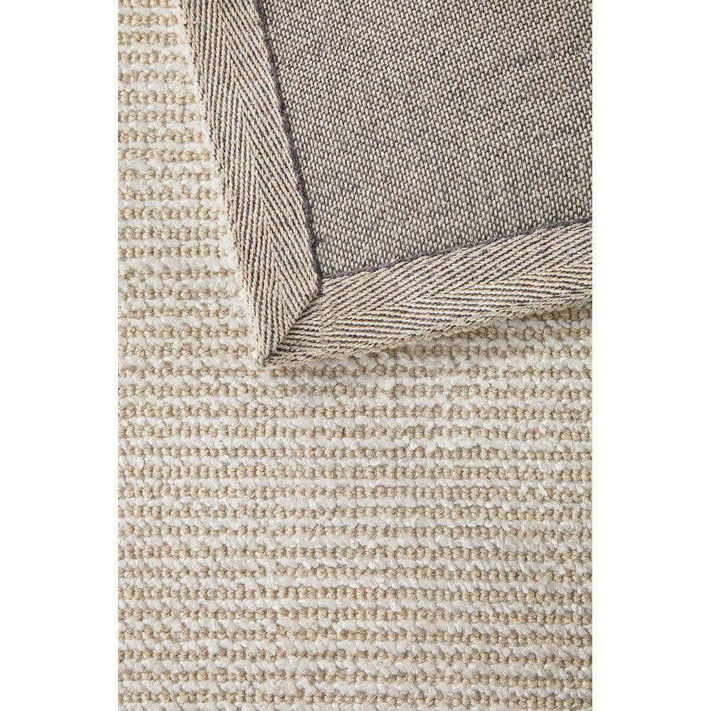 Allie Ivory Cotton Rayon Rug featuring solid ivory in ivory, beige and taupe on ivory background, machine-made cotton-rayon