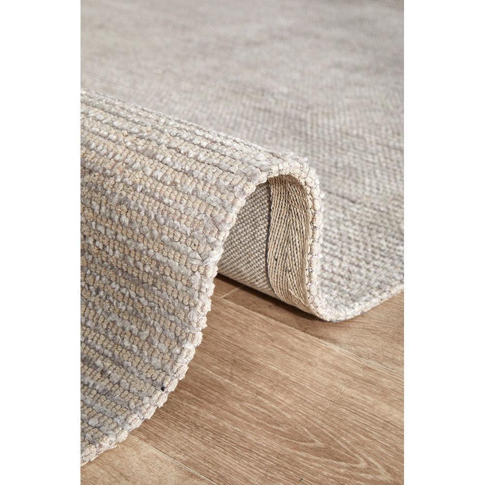 Allie Stone Cotton Rayon Rug featuring textured boucle in stone, beige, ivory on natural wood floor, handcrafted cotton-rayon blend