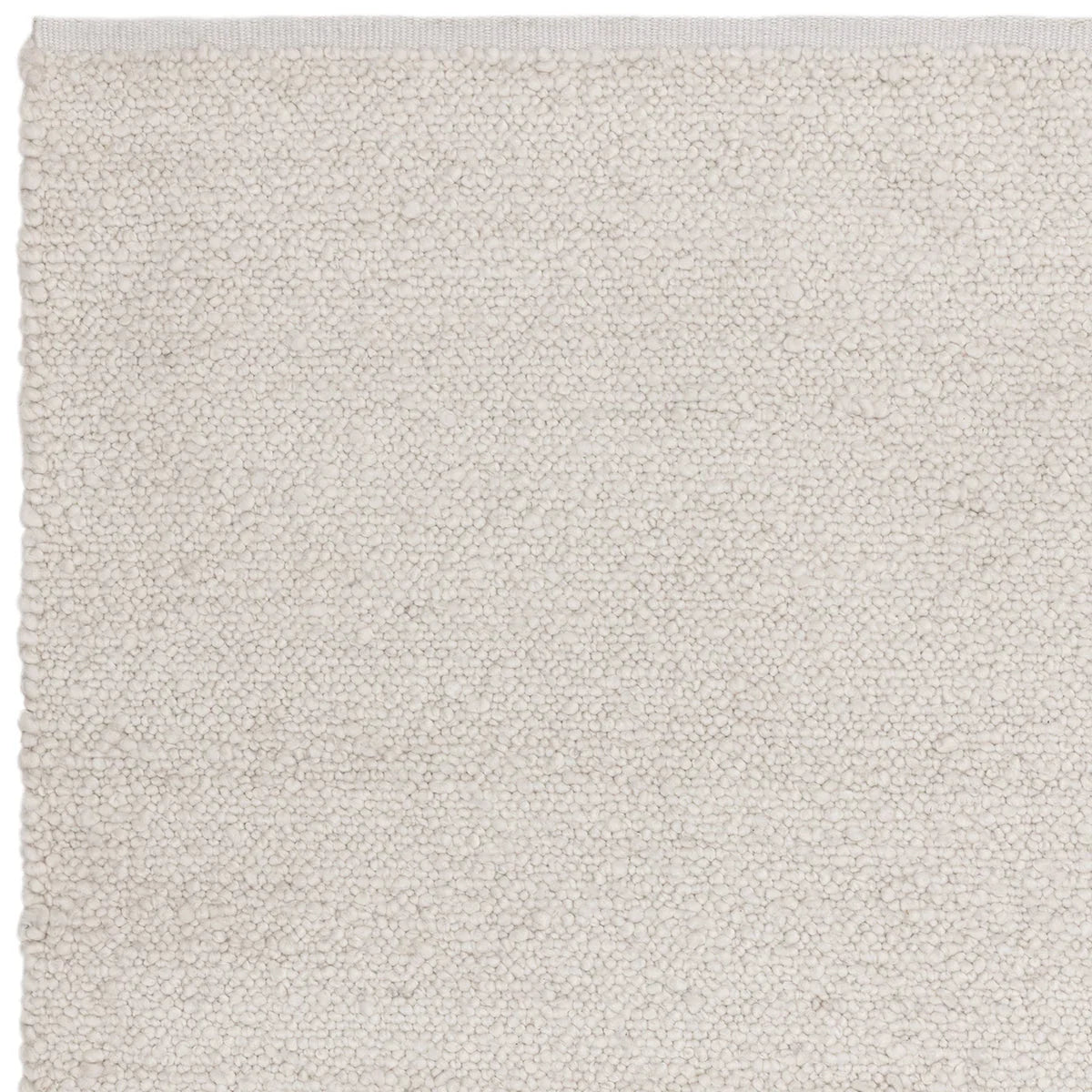 Asiatic Abbus Ivory Designer Rug featuring solid textured boucle in ivory, cream and off-white on white background, tufted wool