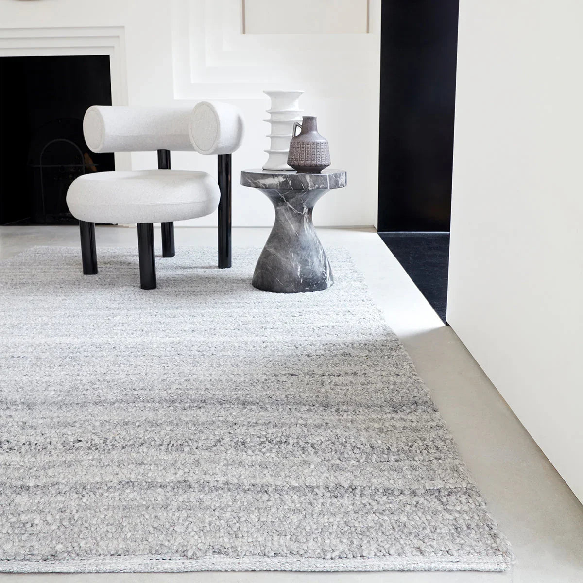 Asiatic Abbus Steel Designer Rug featuring textured shag in steel grey, light grey and silver on white backdrop, woven wool