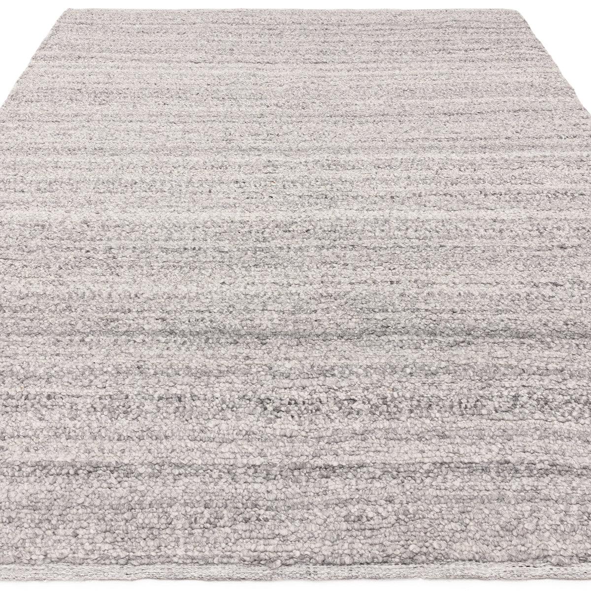 Asiatic Abbus Steel Designer Rug featuring subtle striped texture in steel grey and ivory on light grey hand-tufted wool