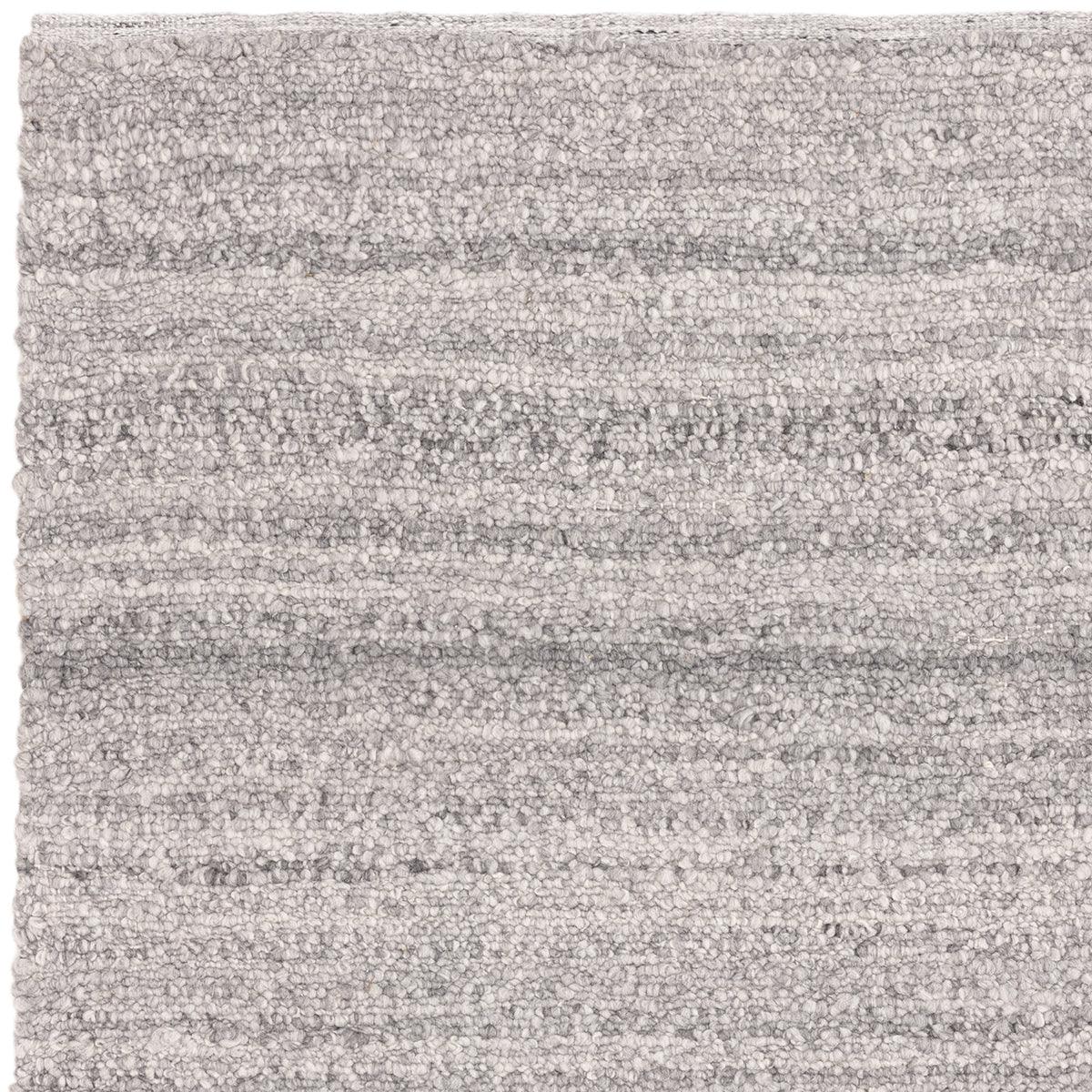 Asiatic Abbus Steel Designer Rug featuring a soft striped textured pattern in steel grey, charcoal and light grey on white background