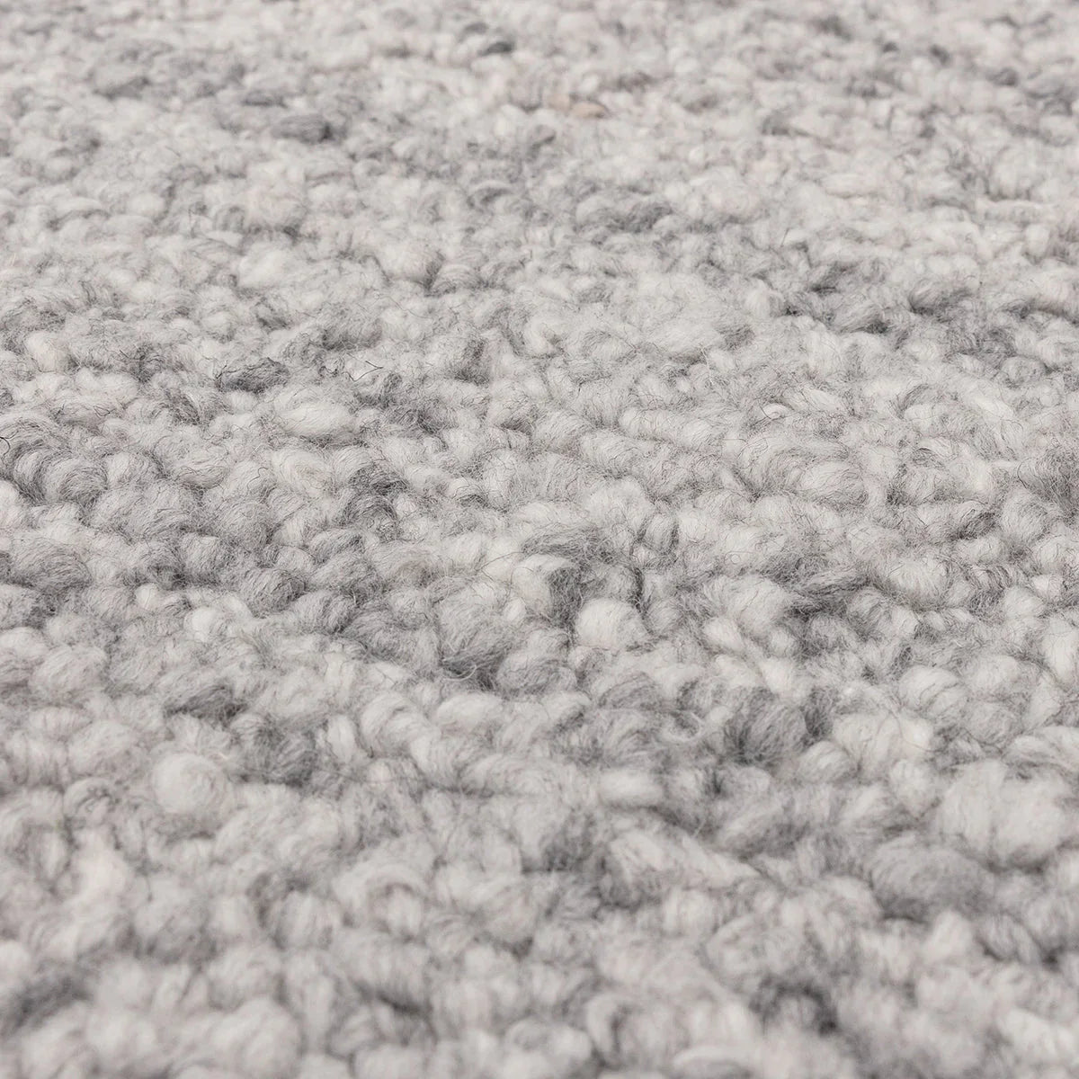 Asiatic Abbus Steel Designer Rug featuring chunky boucle texture in steel grey and pale grey