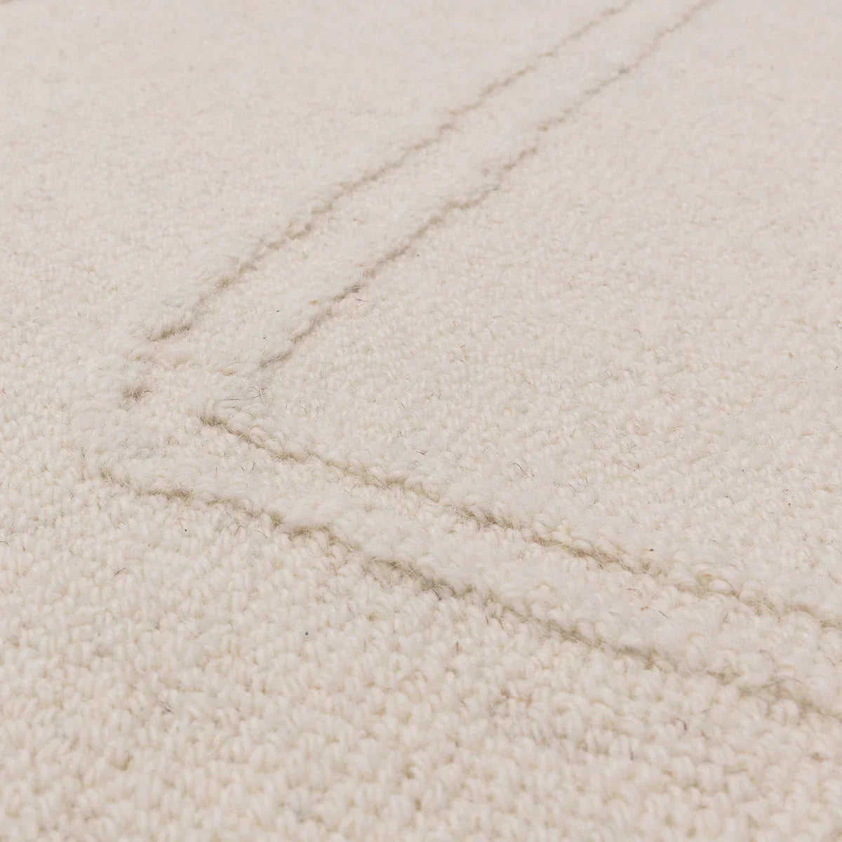 Asiatic Ada Ivory Designer Rug featuring solid shag texture in ivory, cream and warm beige on ivory background, hand-tufted wool