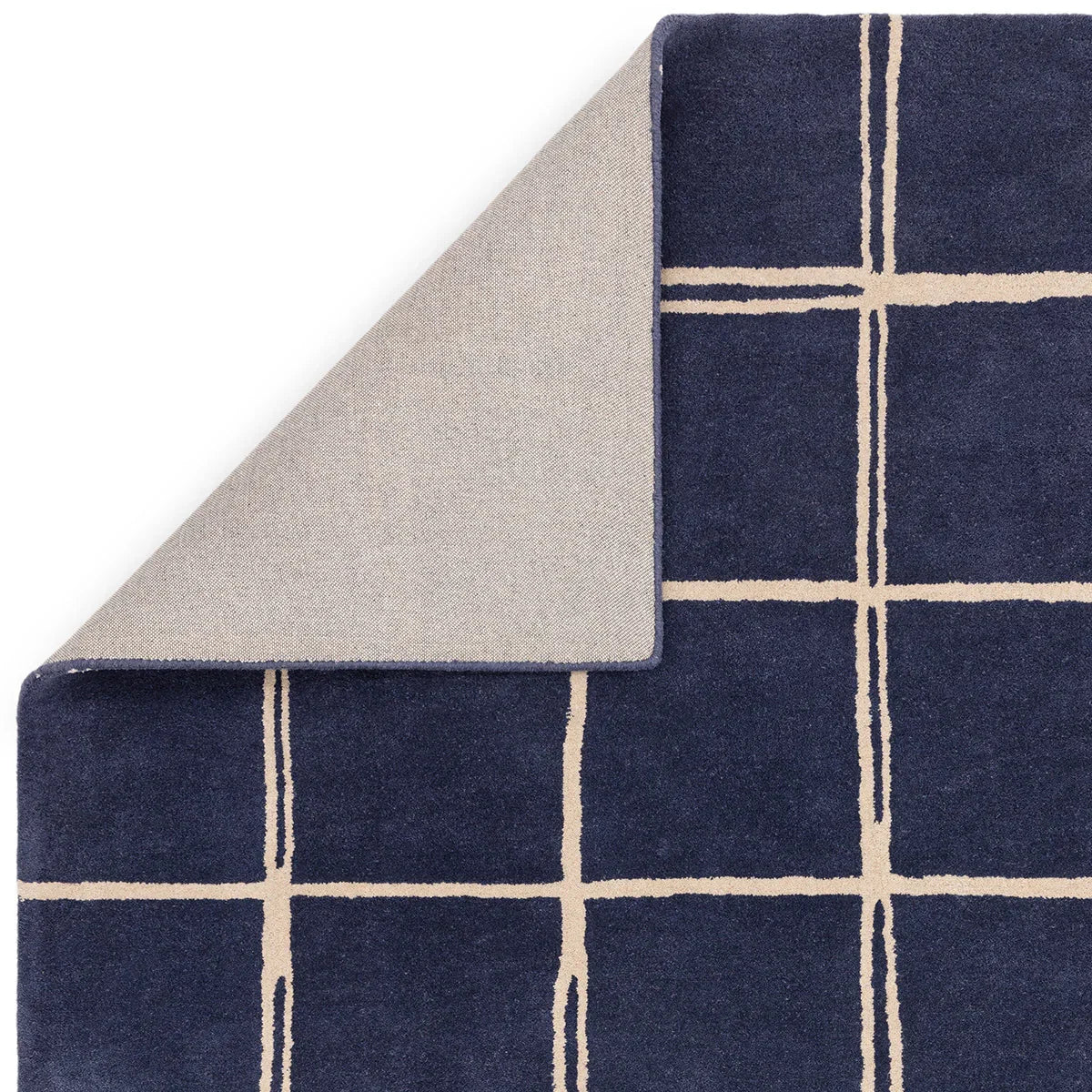 Asiatic Albany Grid Marine Designer Rug featuring navy grid with cream lines on navy background, construction not specified