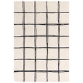 Asiatic Albany Grid Monochrome rectangle rug styled in a living room