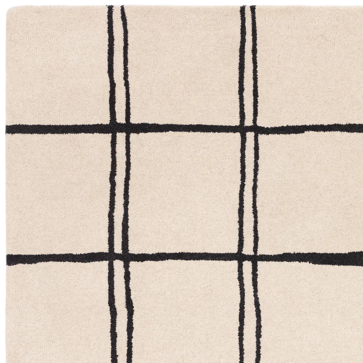 Asiatic Albany Grid Monochrome Designer Rug featuring grid pattern in black on beige background, hand-tufted wool
