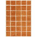 Asiatic Albany Grid Rust rectangle rug styled in a living room