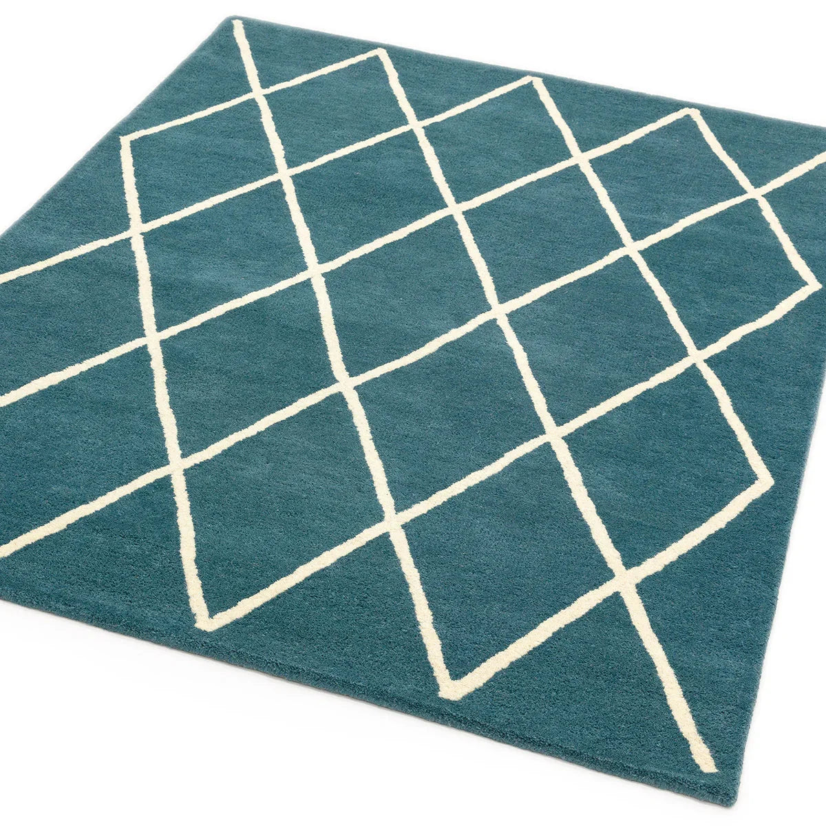 Asiatic Albany Diamond Teal Designer Rug featuring a white diamond-grid pattern on teal background