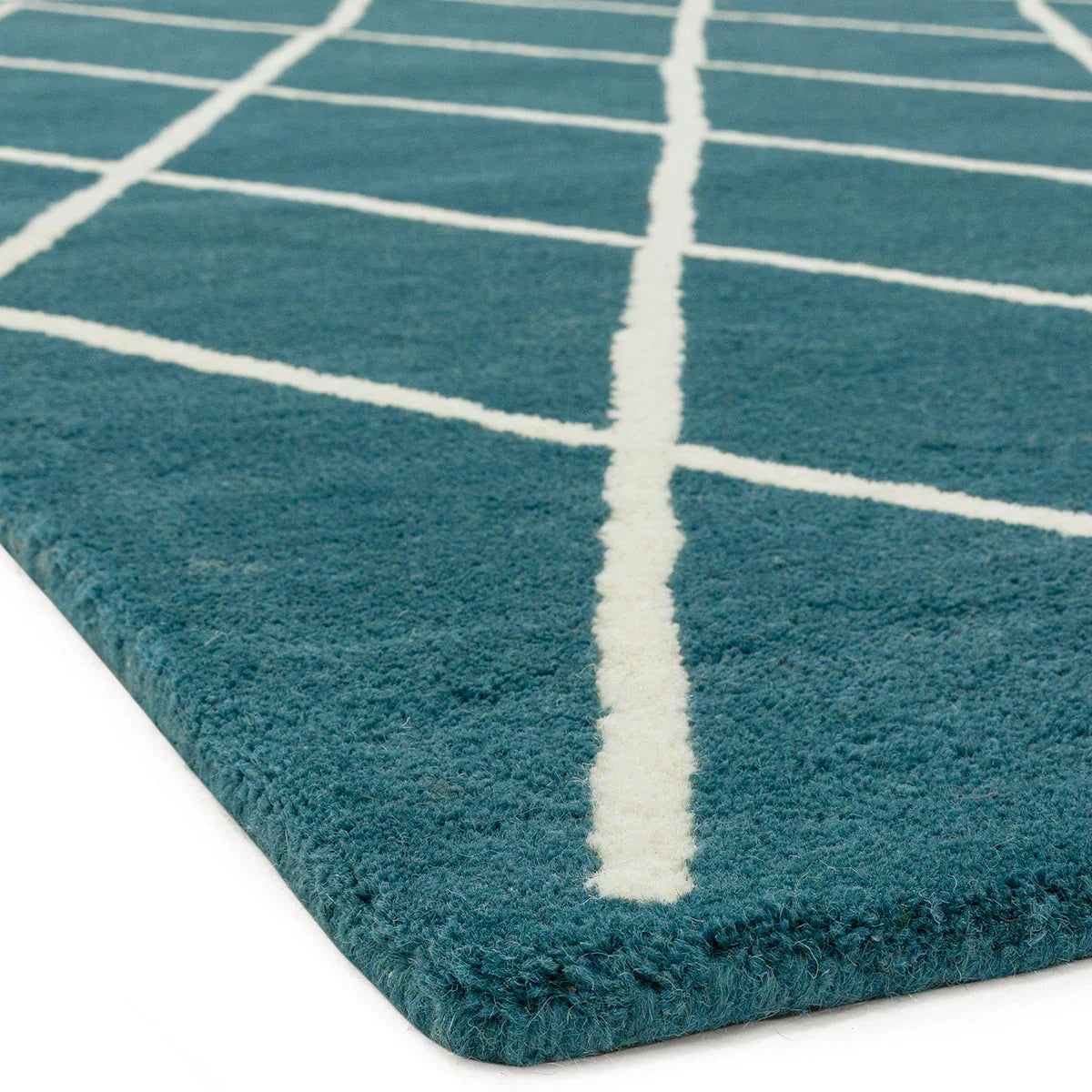 Asiatic Albany Diamond Teal Designer Rug featuring geometric grid in teal and cream on teal background