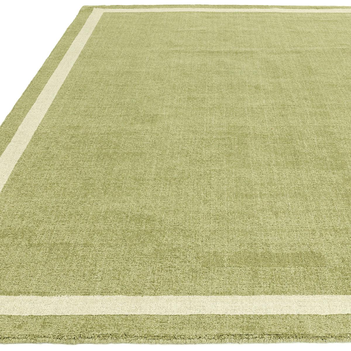 Asiatic Albi Green Designer Rug featuring a border in olive green and cream on white background, hand-tufted wool