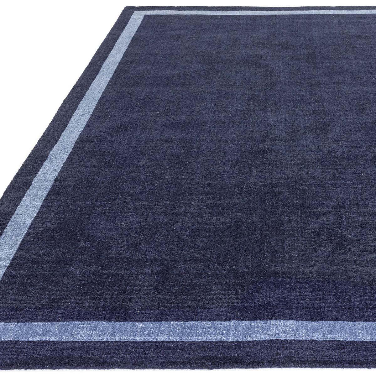 Asiatic Albi Navy Designer Rug featuring navy field with light blue border on white background, hand-tufted wool