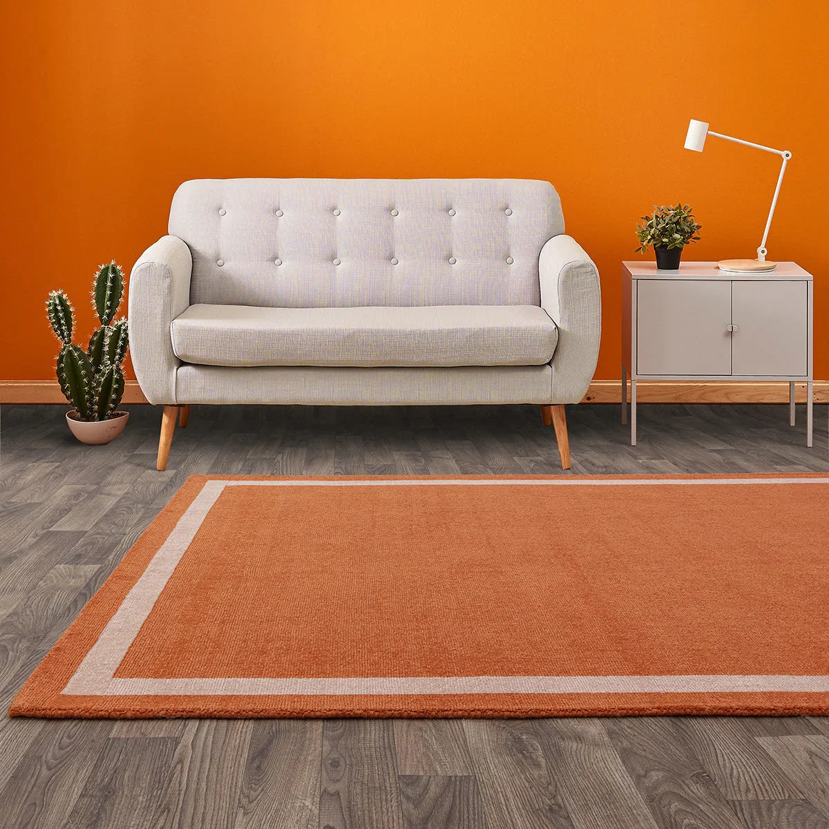 Asiatic Albi Orange Designer Rug featuring orange field with cream border on orange background, hand-tufted wool