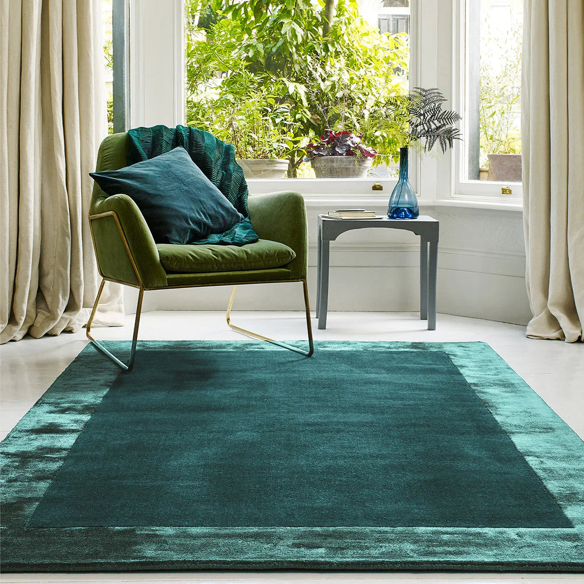 Asiatic Ascot Aqua Blue Designer Rug featuring tonal gradient in deep teal, aqua and turquoise on white tufted wool