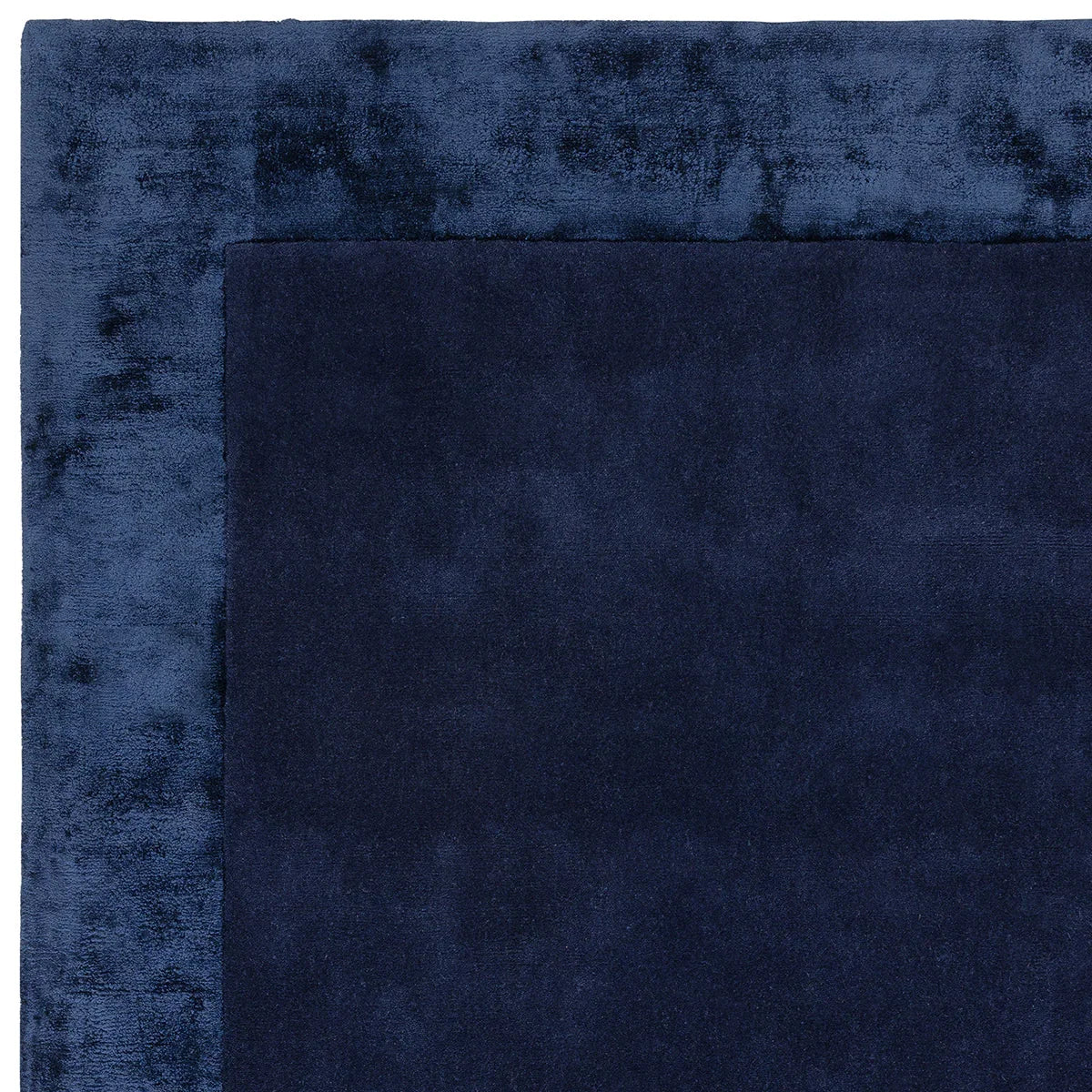 Asiatic Ascot Navy Designer Rug featuring navy/royal/powder-blue field with border on white machine-made polypropylene
