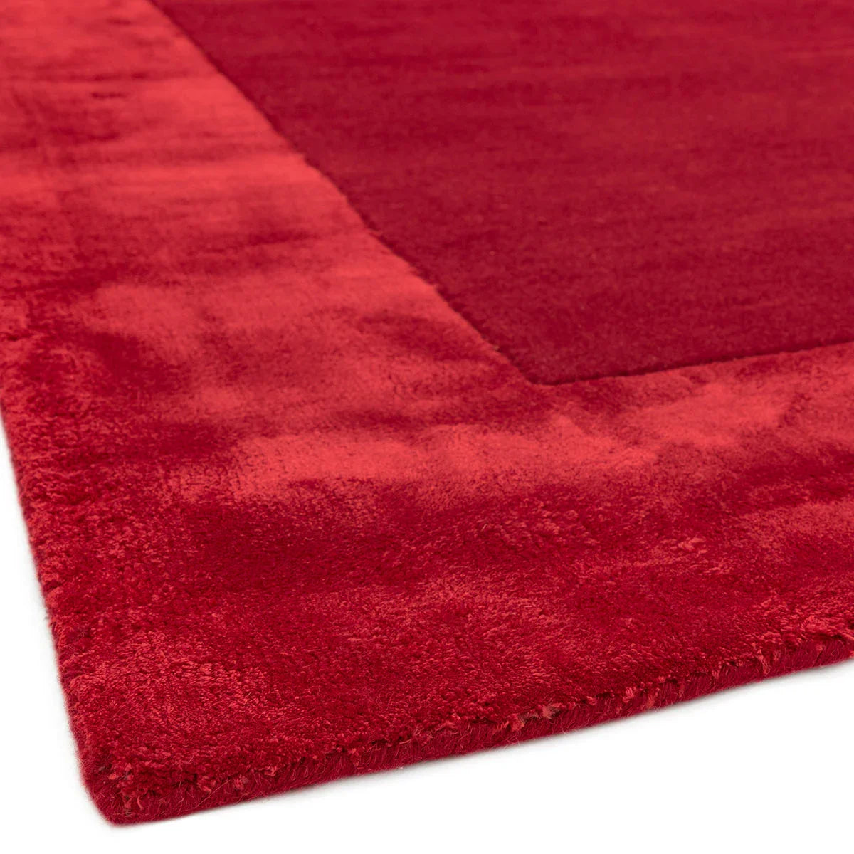 Asiatic Ascot Red Designer Rug featuring solid colour in crimson red, scarlet red, burgundy on white, machine-made wool
