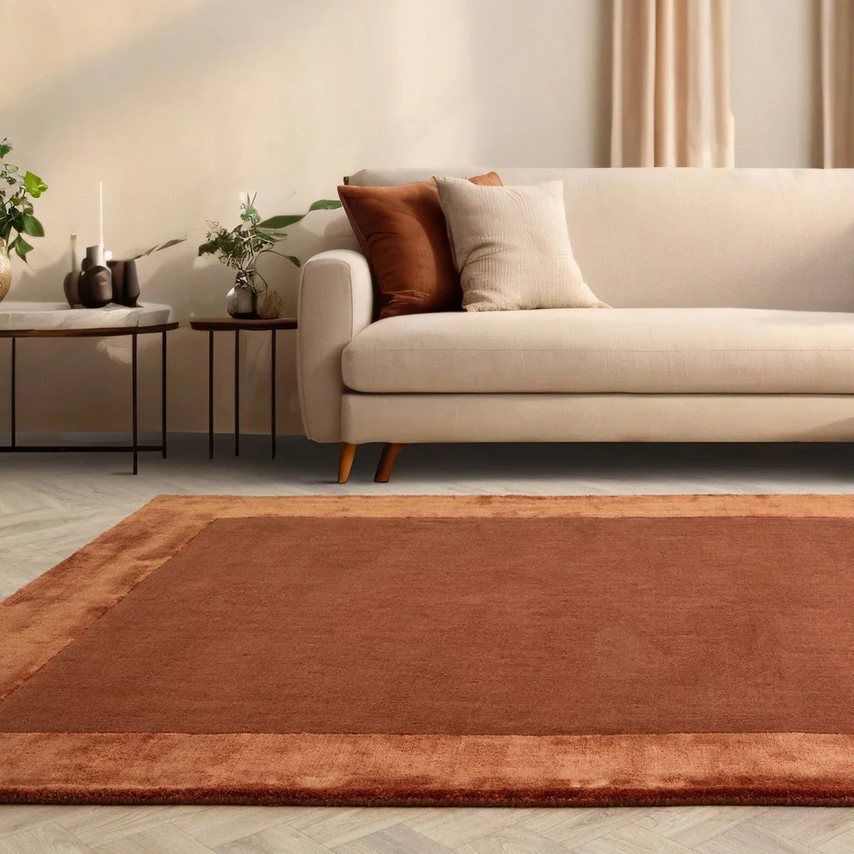 Asiatic Ascot Rust Designer Rug featuring solid rust field with copper border on warm beige background, hand-tufted wool