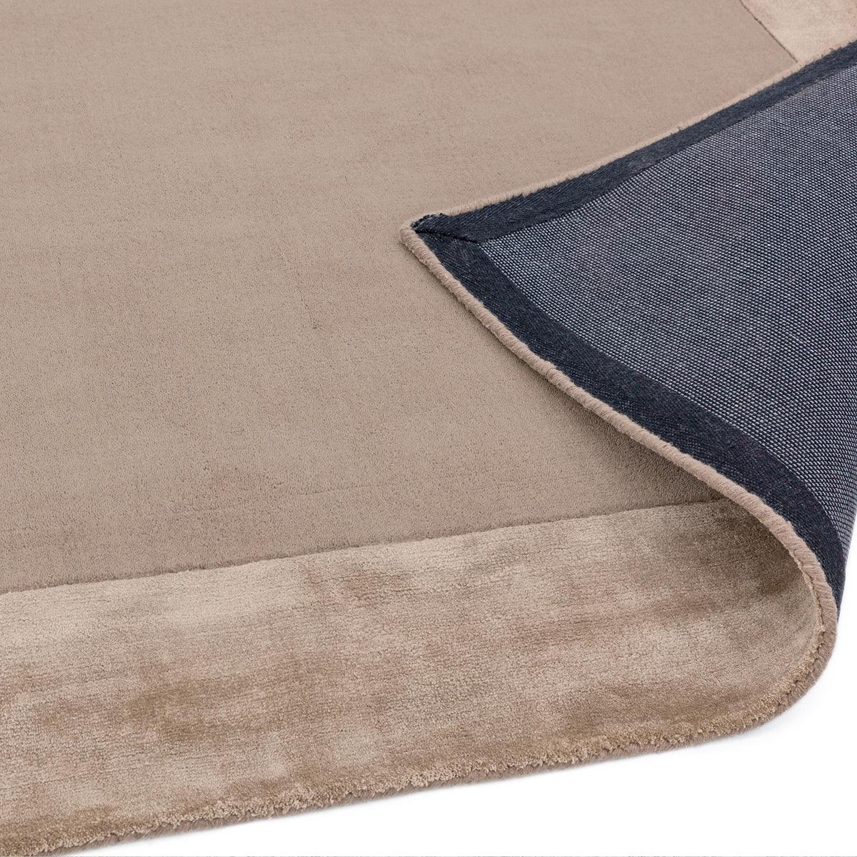 Asiatic Ascot Sand Designer Rug featuring solid sand field with navy border on beige background, hand-tufted wool