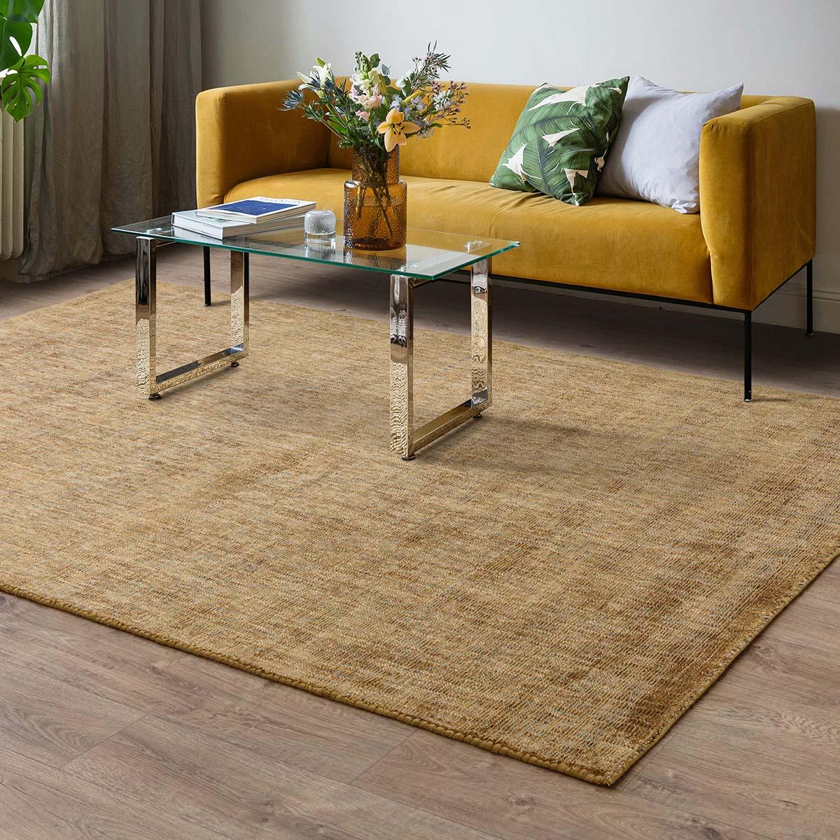 Asiatic Aston Ochre Designer Rug featuring textured weave in ochre, gold and beige on light oak floor, hand-woven wool