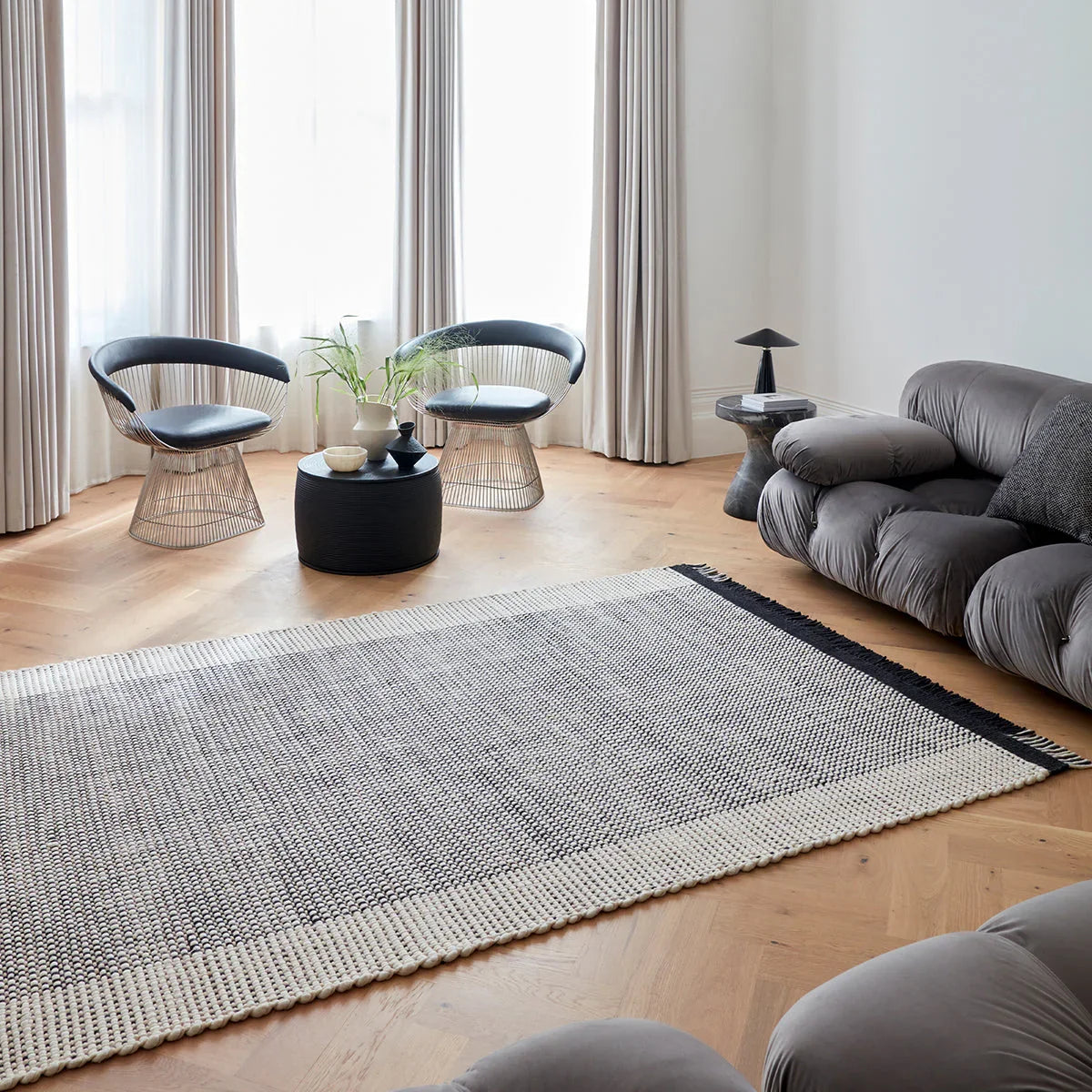 Asiatic Avalon Monochrome Designer Rug featuring textured weave in cream, ivory and charcoal on honey floor, tufted wool