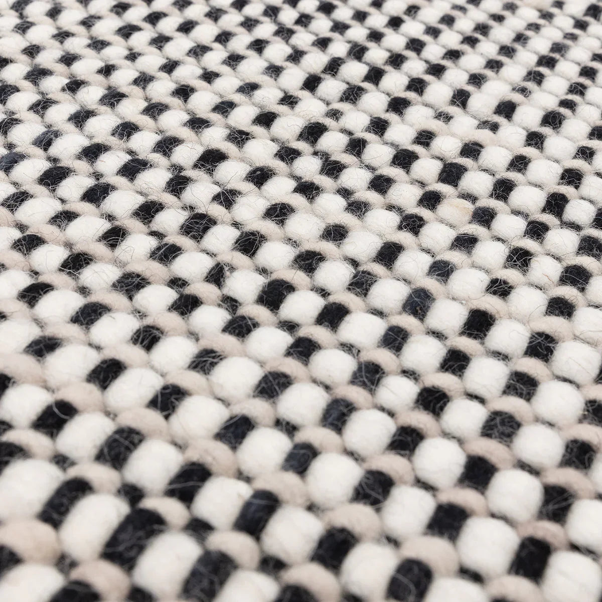 Asiatic Avalon Monochrome Designer Rug featuring checkerboard in white, black, ivory, beige on cream, hand-tufted wool
