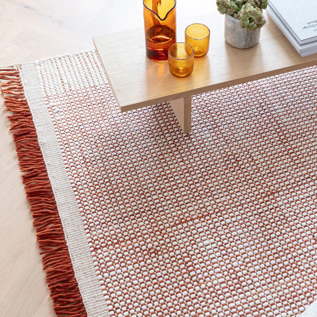 Asiatic Avalon Rust Designer Rug featuring a dotted geometric pattern in rust, ivory and cream on cream base, tufted wool