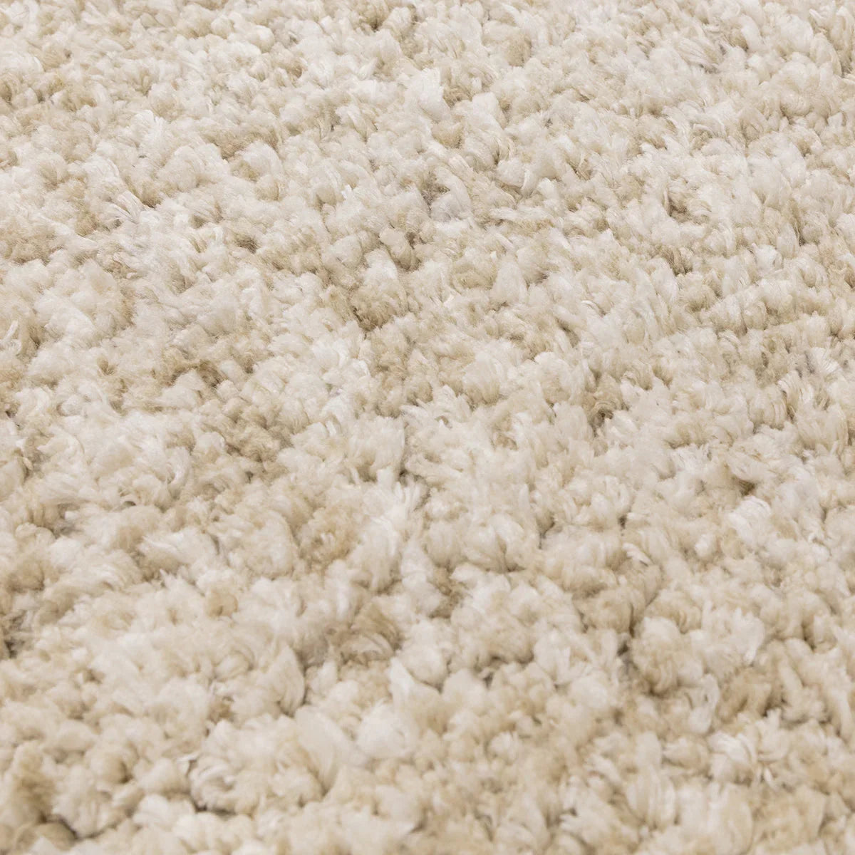 Asiatic Barnaby Sand Designer Rug featuring shaggy pile texture in sand, beige and cream on cream background, hand-tufted wool