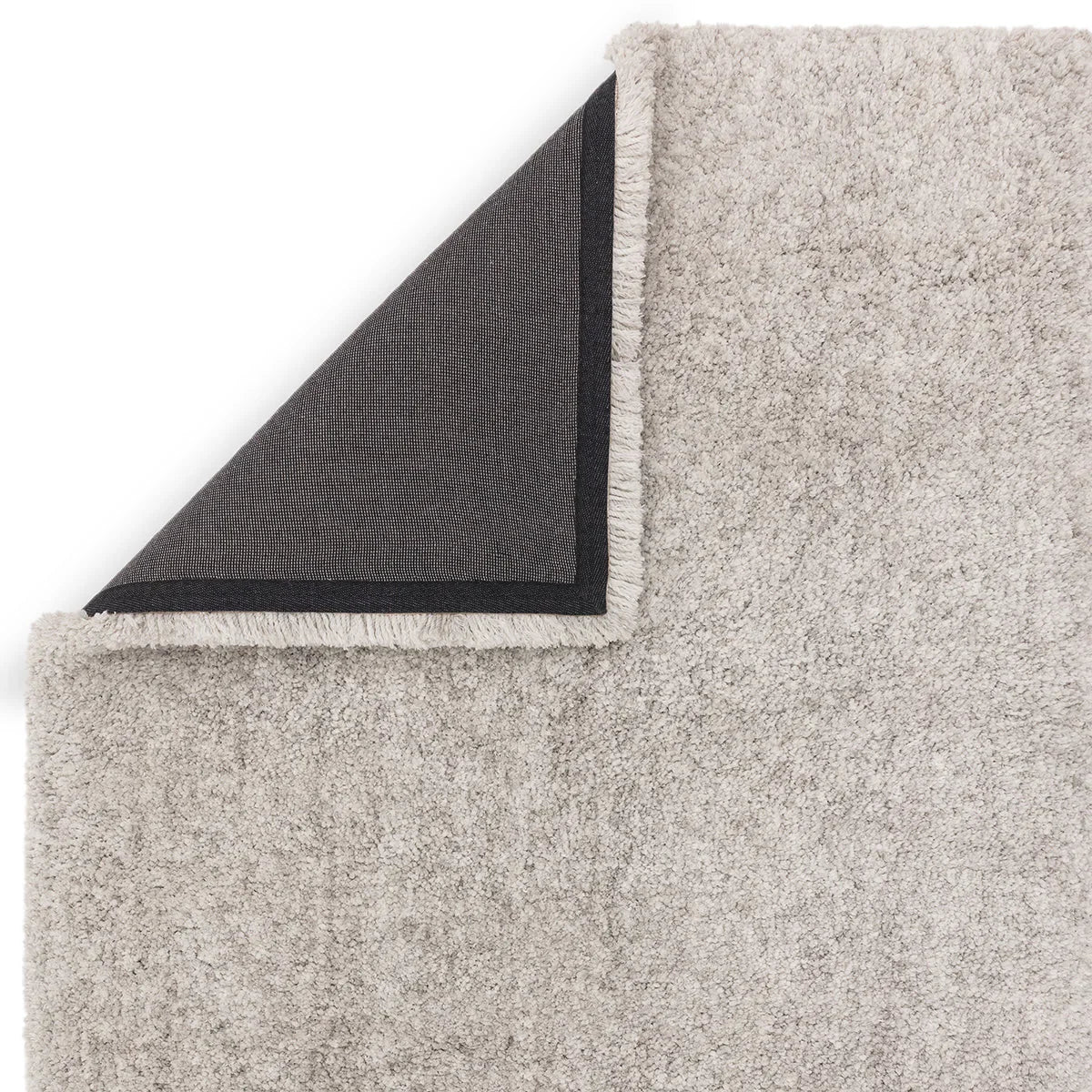 Asiatic Barnaby Silver Designer Rug featuring solid shag texture in light silver-beige on cream background, hand-tufted wool