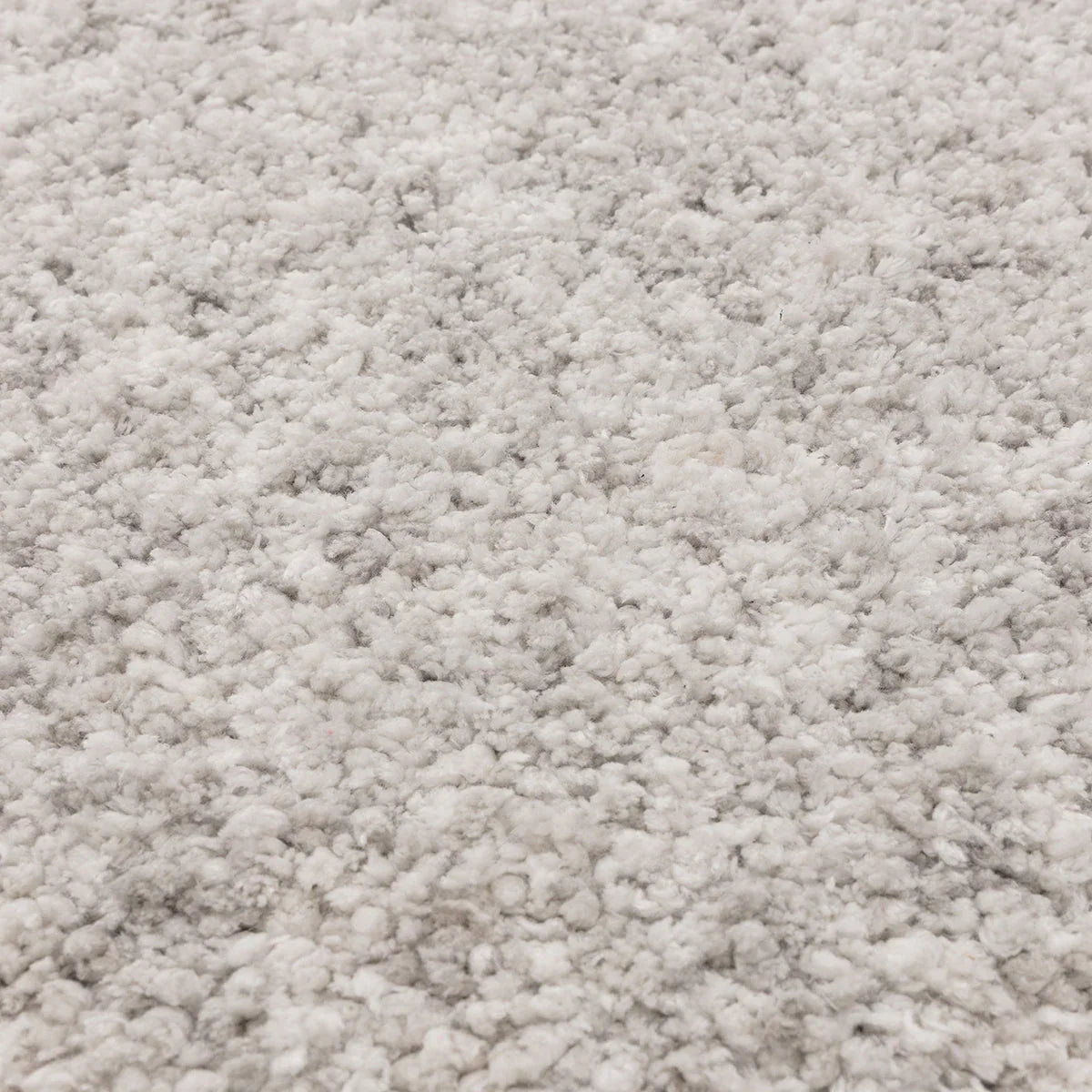 Asiatic Barnaby Silver Designer Rug featuring textured shag pile in pale silver-grey on light grey background.