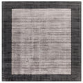 Asiatic Blade Border Charcoal Silver Square square rug styled in a living room