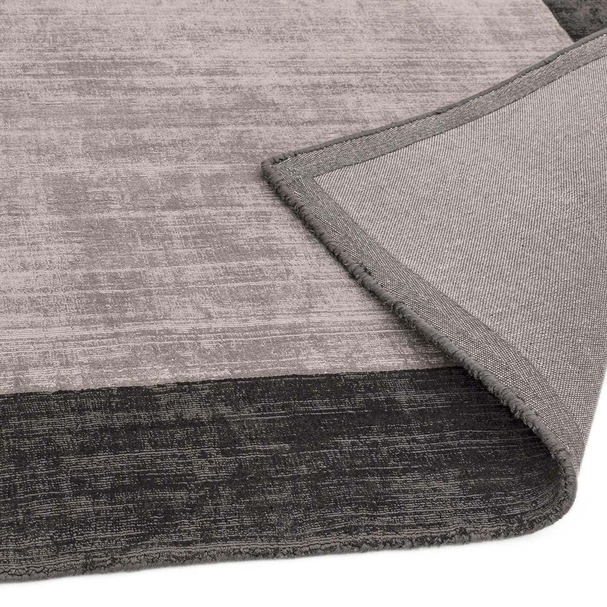 Asiatic Blade Border Rug in charcoal, medium grey and light grey on light grey background, power-loomed polypropylene