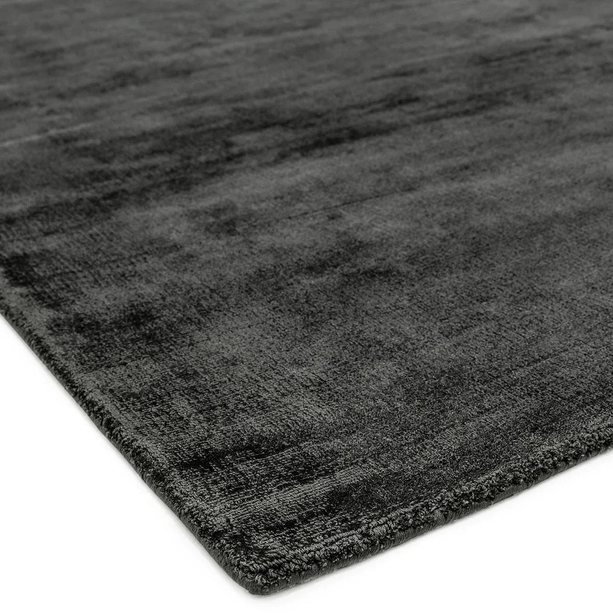 Asiatic Blade Charcoal Runner featuring textured charcoal, graphite and black on white background, machine-woven wool