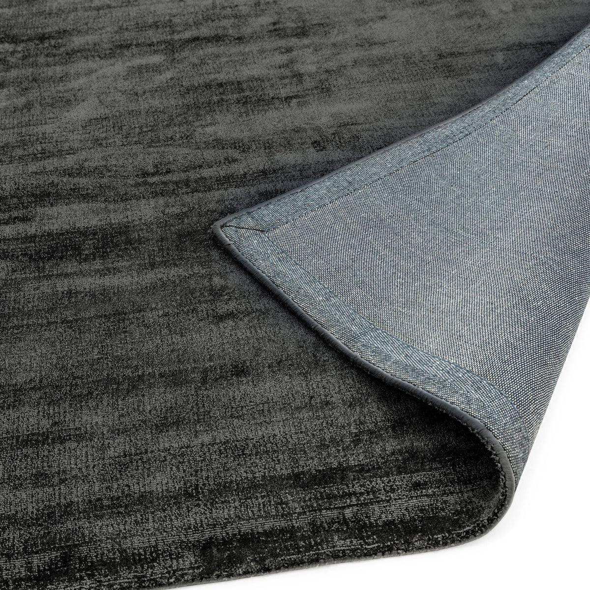 Asiatic Blade Charcoal Designer Rug featuring distressed texture in charcoal, graphite and ash on white background