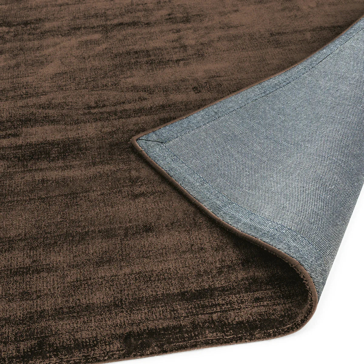 Asiatic Blade Chocolate Runner Rug featuring distressed texture on chocolate brown, blue denim backing, machine-made wool