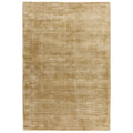Asiatic Blade Soft Gold rectangle rug styled in a living room