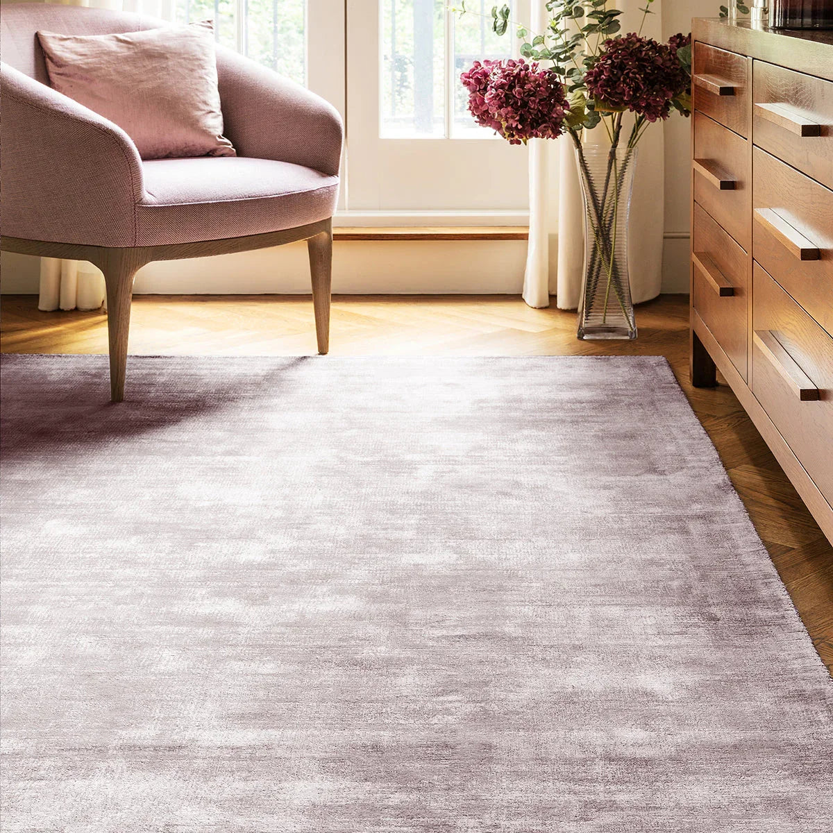 Asiatic Blade Heather Designer Rug featuring tonal gradient in dusty lilac, mauve, lavender on light beige floor, hand-tufted wool