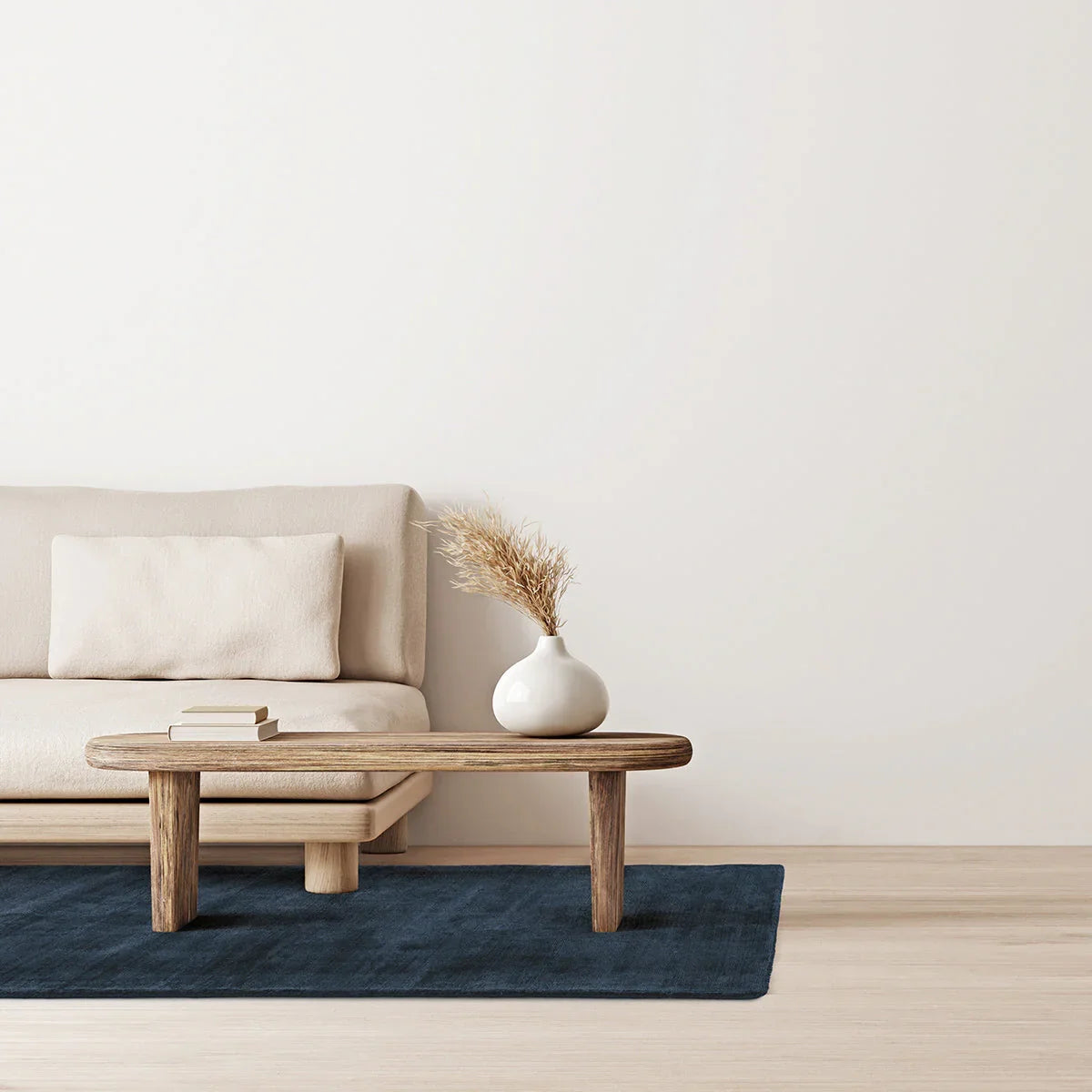 Asiatic Blade Navy Runner Designer Rug featuring solid navy on cream background with beige sofa, hand-tufted wool