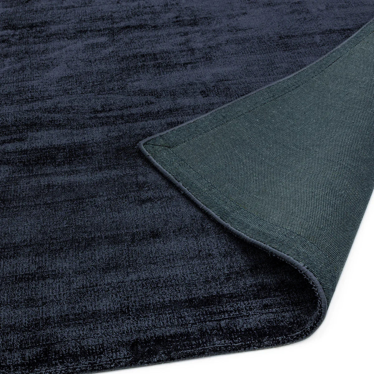 Asiatic Blade Navy Runner Designer Rug featuring solid velvet texture in navy blue, teal and charcoal on white background, machine-woven polyester