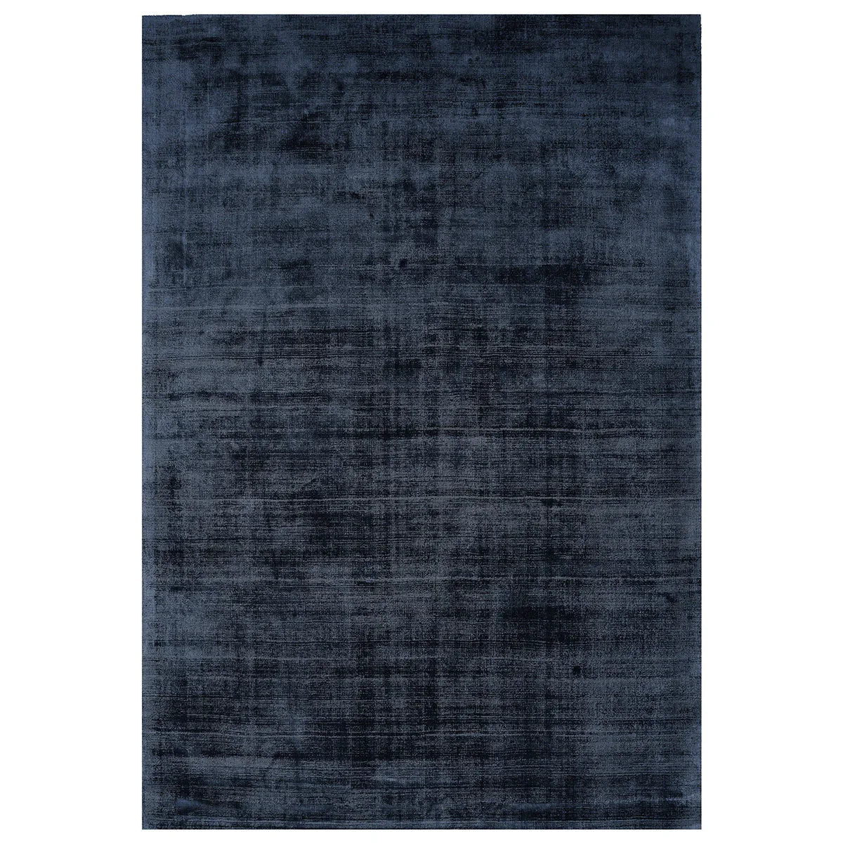 Asiatic Blade Navy rectangle rug styled in a living room