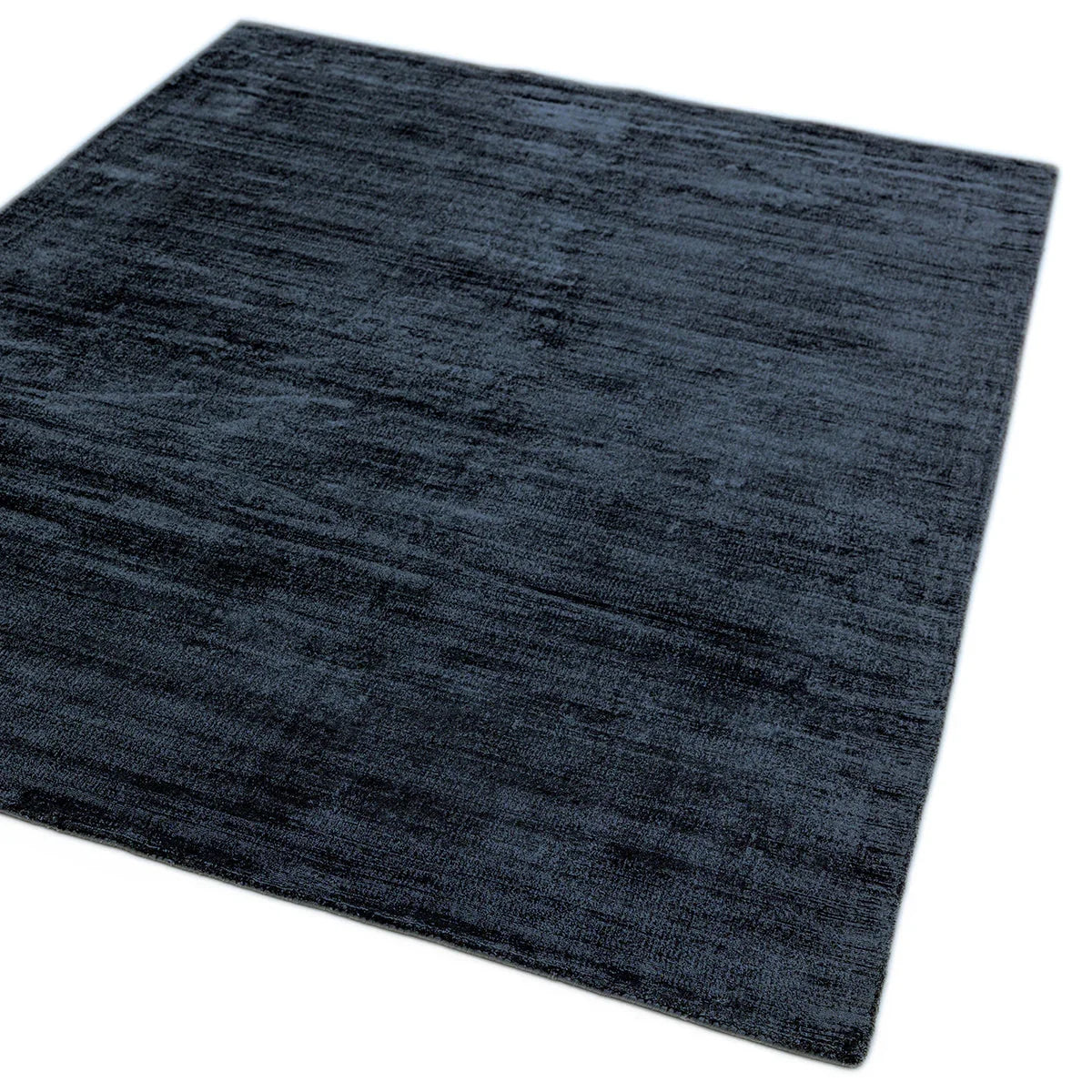Asiatic Blade Navy Designer Rug featuring solid texture in navy and graphite on white background machine-made wool