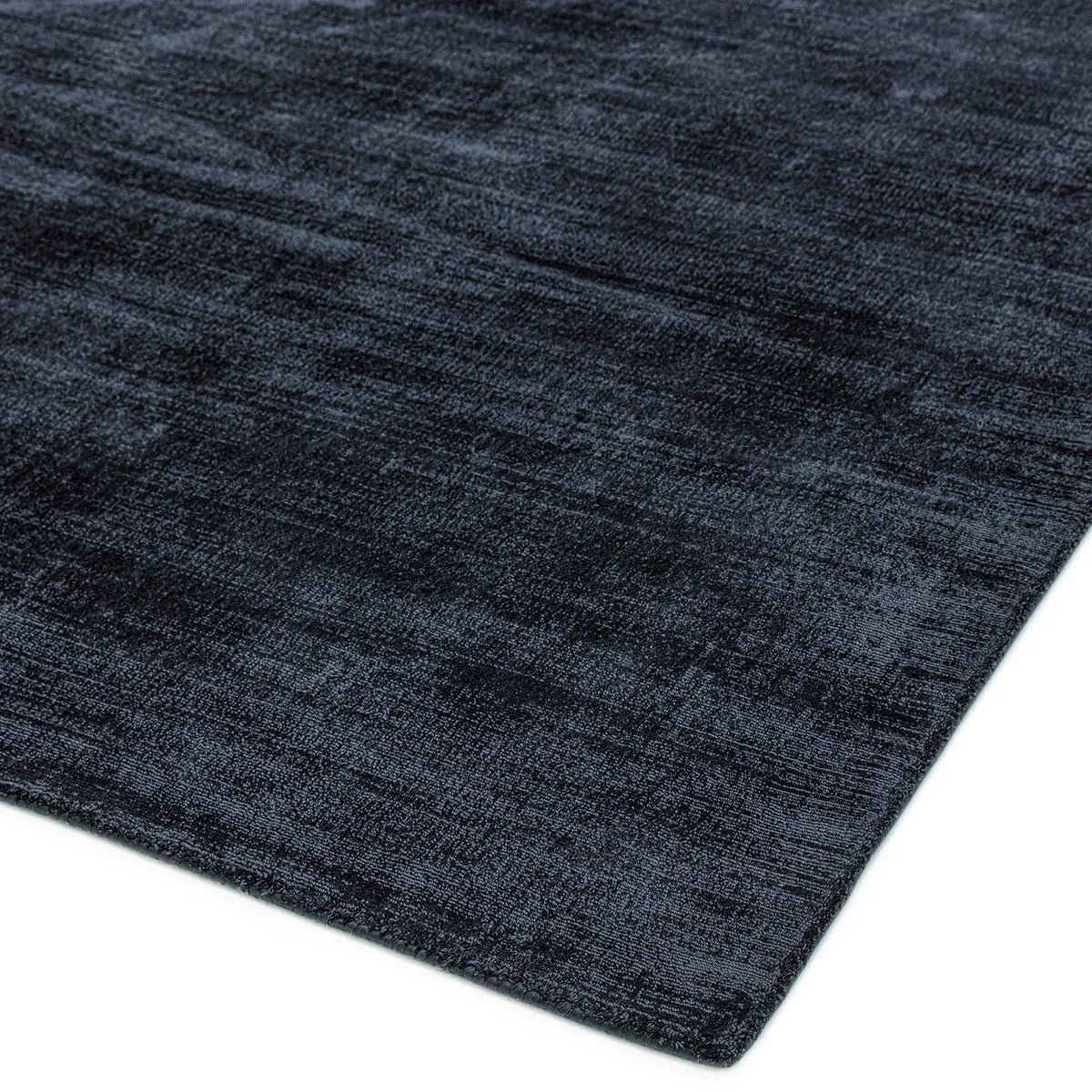 Asiatic Blade Navy Designer Rug featuring solid textured pattern in navy, charcoal and slate on white machine-woven wool
