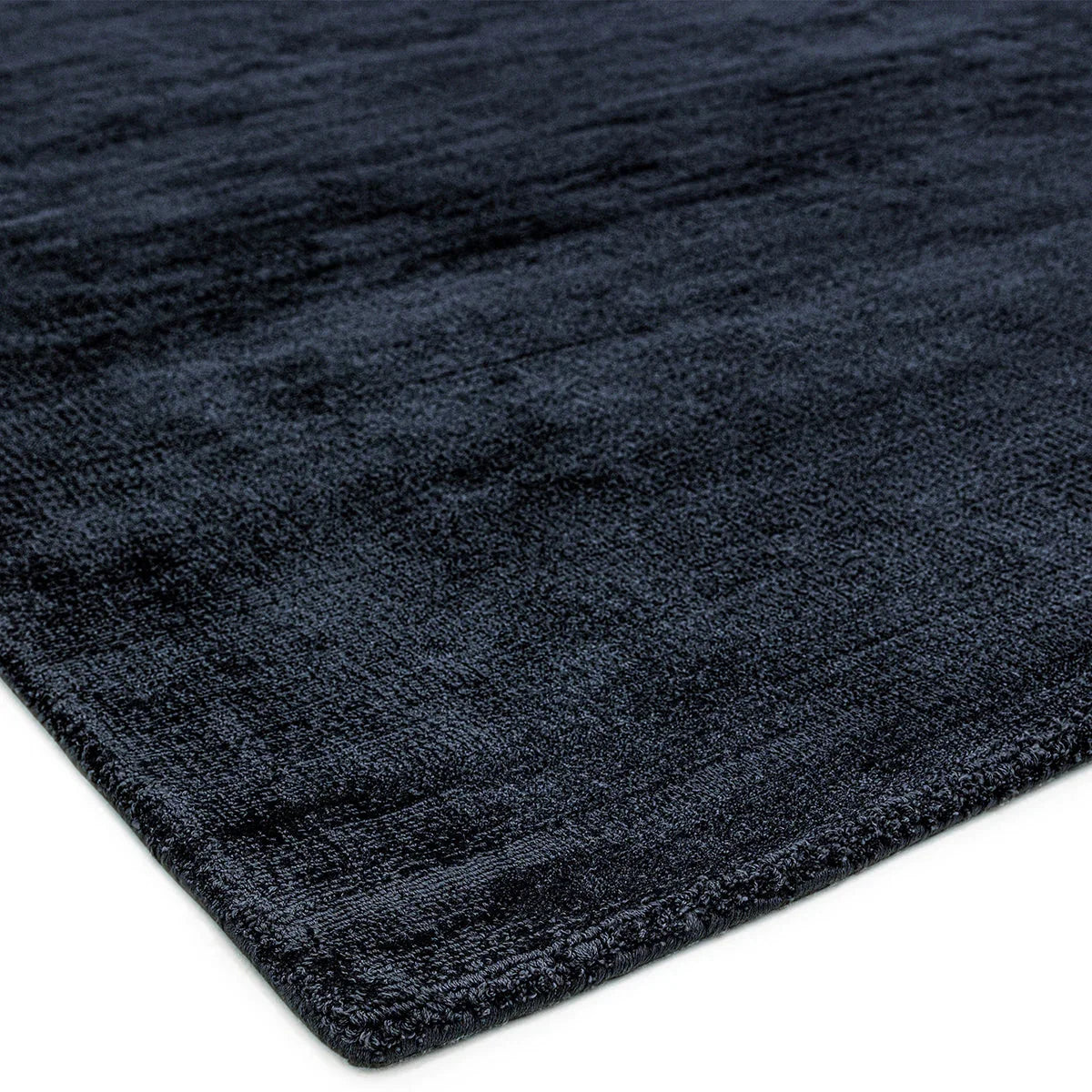 Asiatic Blade Navy Designer Rug featuring navy blue velvet texture on white background, machine-woven polypropylene