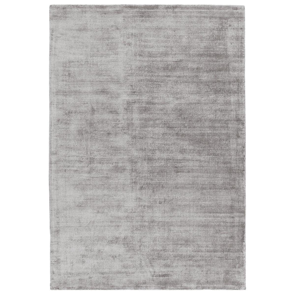 Asiatic Blade Silver rectangle rug styled in a living room