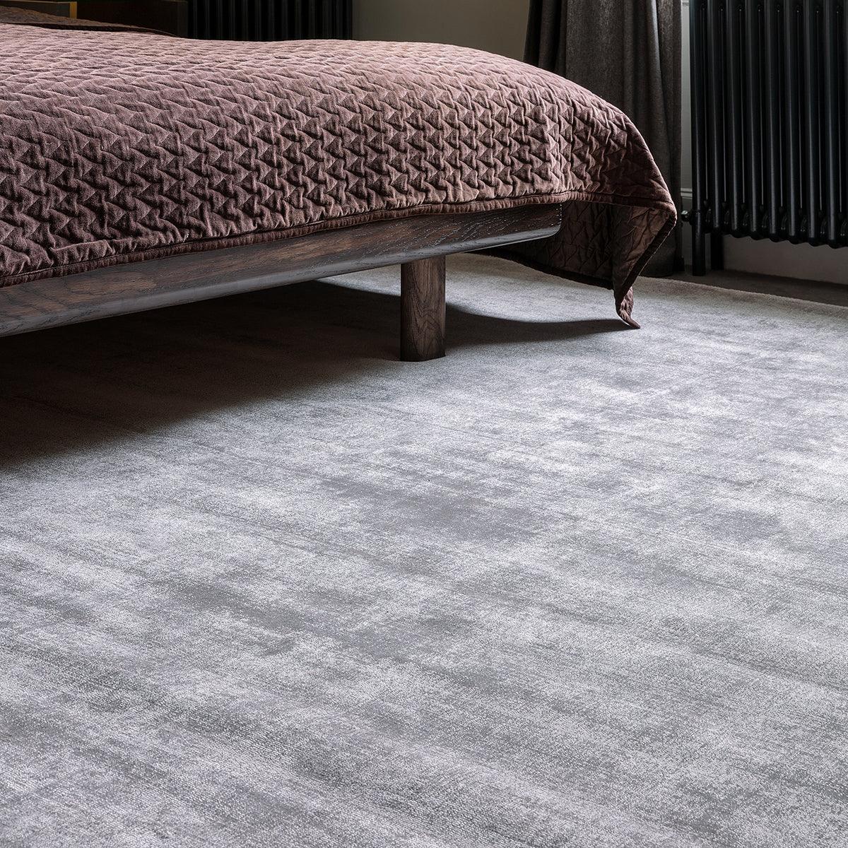 Asiatic Blade Silver Designer Rug featuring textured solid pattern in silver-grey on light grey floor, hand-tufted wool
